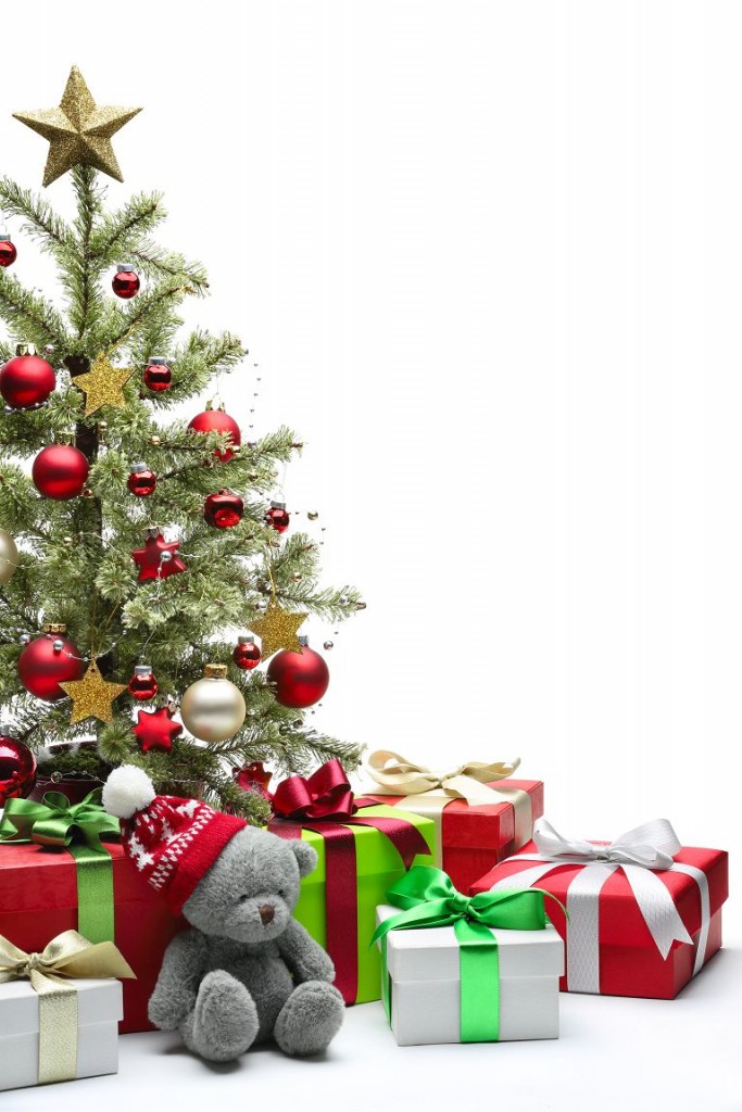 Decorated Christmas tree and gifts on white background